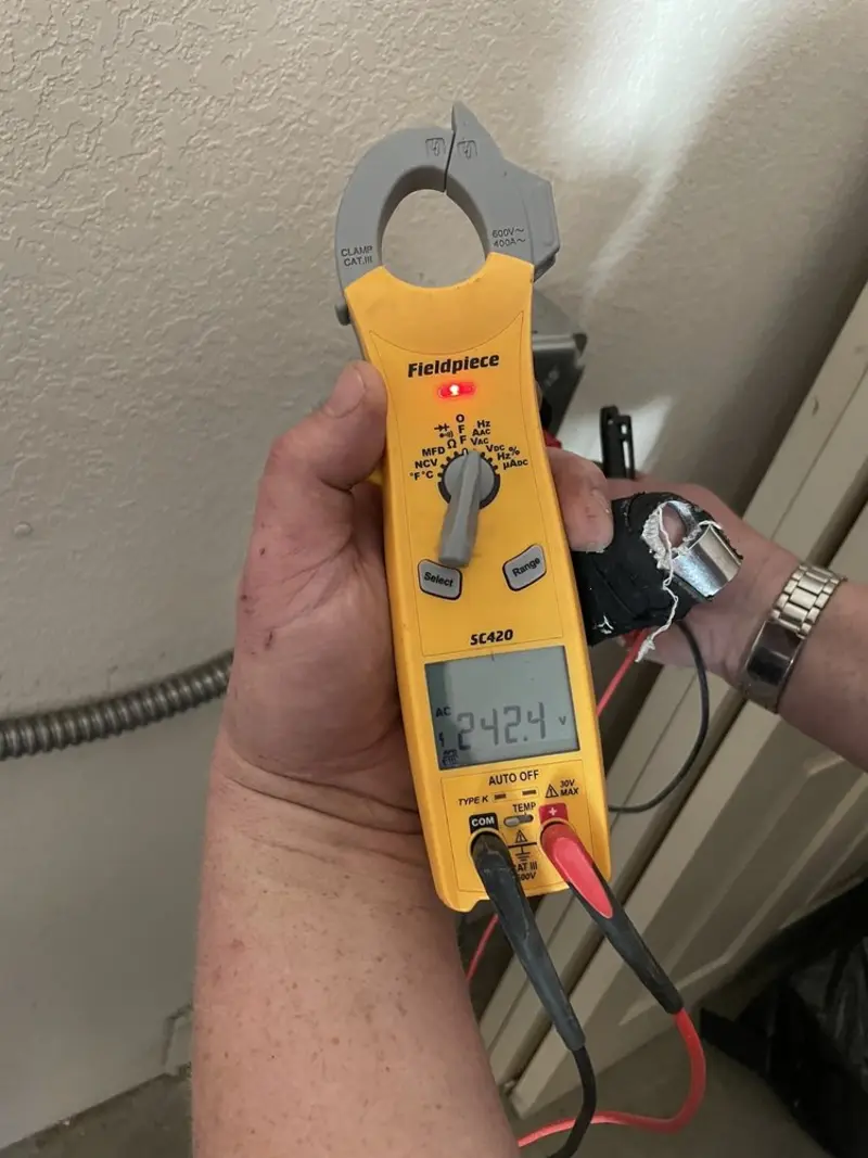 Voltage testing with clamp meter during Circuit Breaker Repair in Manor